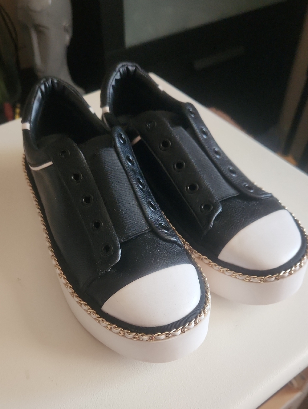 Karl Lagerfeld Black Sneakers with White Toe Detail and Gold Chain Accent